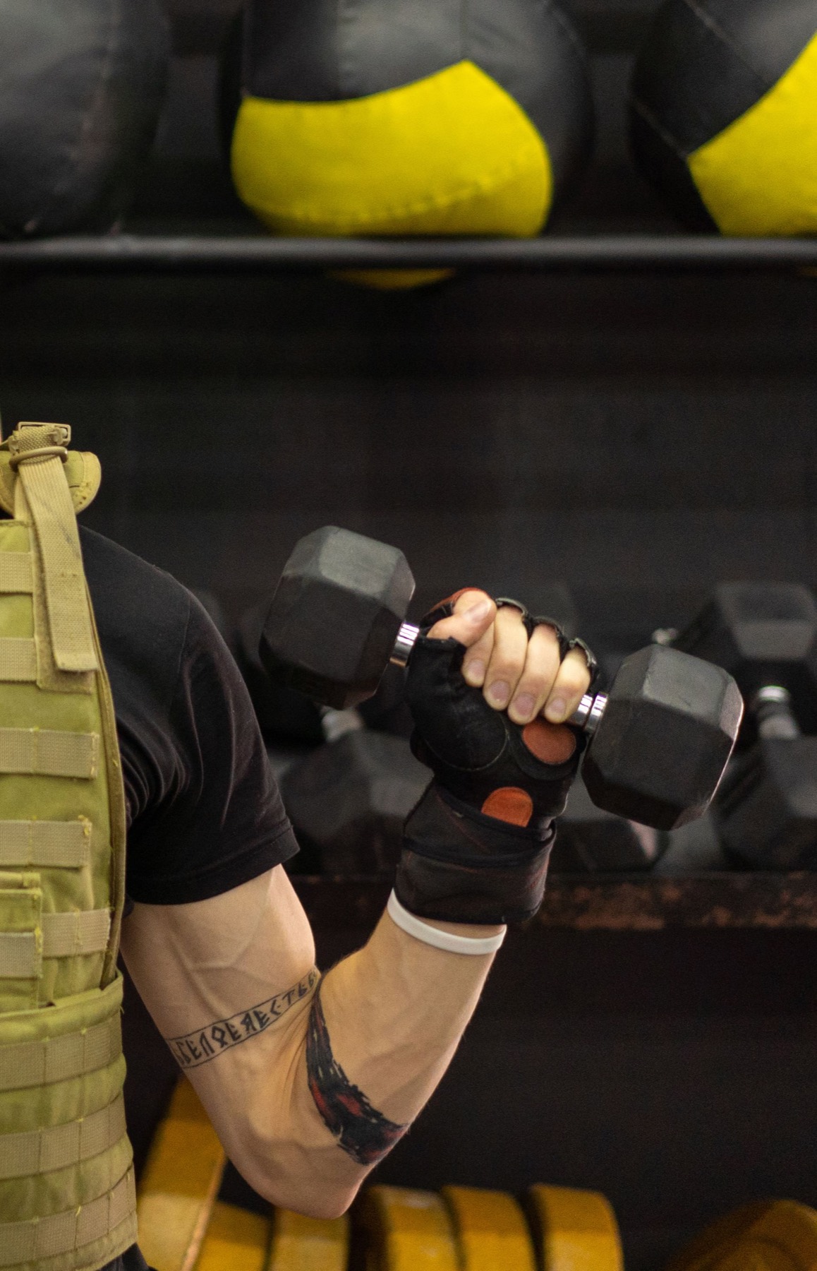 Athlete training with a dumbbell
